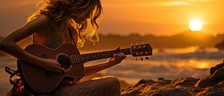 Girl guitarist in silhouette against a sunsetの素材