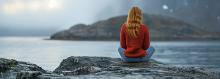 a woman relaxing on the rocksの素材