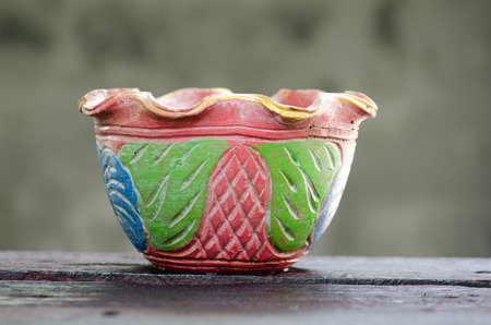 Beautiful clay pots placed on a table behind a concrete gray color.の写真素材