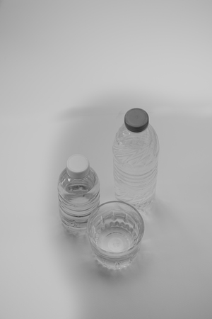Clean water bottle and drink a glass of white foggy beautiful reclaimed.の写真素材