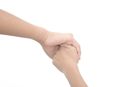 Two little kids holding hands and holding hands walking. The media love ties and caring to step into the vast world.の写真素材