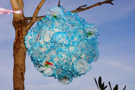 Decorative Flower ball hanging on a tree の写真素材