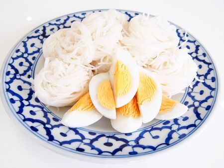 boiled egg with   Rice noodles on White tableの写真素材