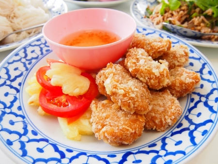 fired shrimp meat ball with sauce and fruitの写真素材