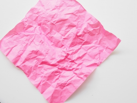 The Pink crumpled paper on a white backgroundの写真素材