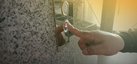 Press the button down to activate the lift.の写真素材