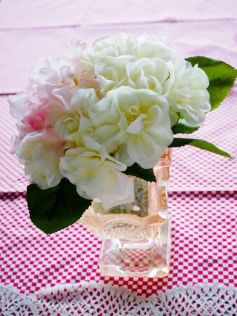 Pink and white flowers on the table.の写真素材