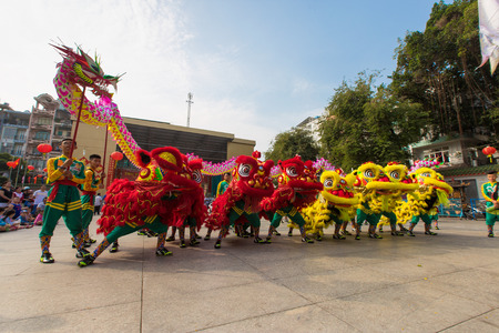 Ho Chi Minh City, Vietnam - February 18, 2015: A show of lion or dragon dance  at Pagoda, China Town, District 5, Cho Lon to praying heathty, safety and lucky during the lunar new year.のeditorial素材
