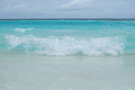 White wave on the sand beach