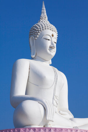 Buddha statue on clear blue skyの写真素材