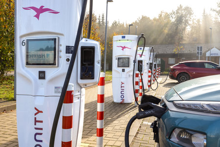 Tiste, Germany - October 21 2022: Electric cars charging at a charging station in Germanyのeditorial素材