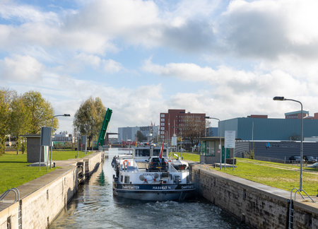 Loaded inland vessel leaves the sash lock in Deventerのeditorial素材