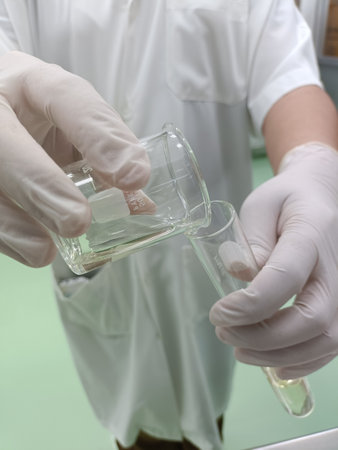 Laboratory researcher working with test tubes in laboratory. Science research and development concept.の写真素材