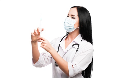 Medical doctor woman with a syringe on white backgroundの写真素材