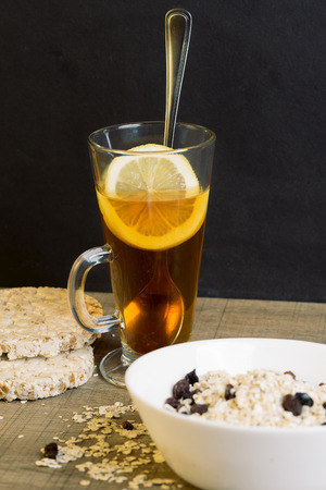 Healthy breakfast, tea with lemon and oatmeaの写真素材