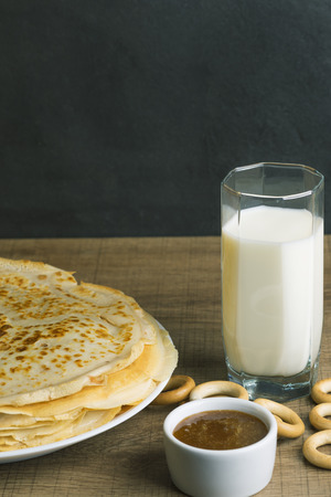 Breakfast milk with pancakes and honey.の写真素材