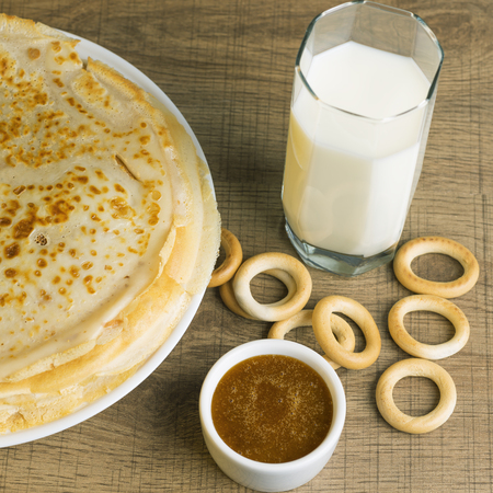 Breakfast milk with pancakes and honey.の写真素材