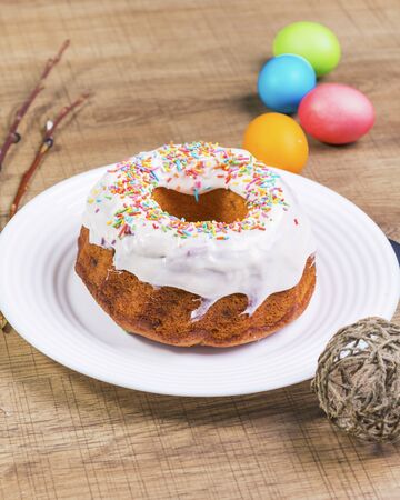 Festive table with colorful Easter eggs and  cupcakeの写真素材
