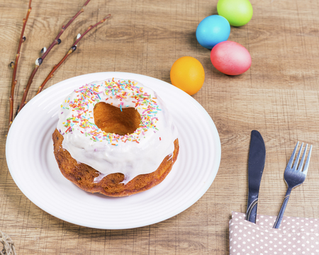 Festive table with colorful Easter eggs and  cupcakeの写真素材