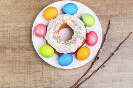Festive table with colorful Easter eggs and  cupcakeの写真素材