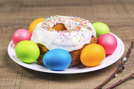 Festive table with colorful Easter eggs and  cupcakeの写真素材