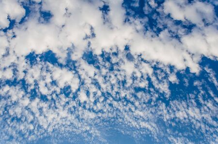 White clouds in a bright blue sky. The beauty of the nature