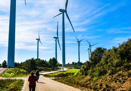 Windmills for the production of electrical energy. Wind farm of renewable, alternative and sustainable energy, province of Barcelonaの写真素材