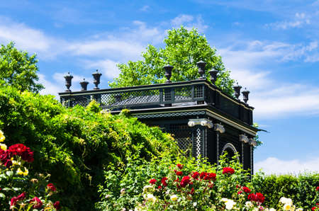 Vienna, Austria June 9, 2019, gardens of the Schonbrunn Palace. Kammergarten pavilion surrounded by flowersのeditorial素材