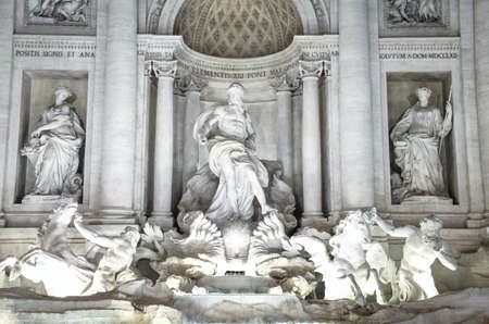 Trevi, Rome; November 28, 2015: The splendor of the monumental Trevi Fountain illuminated at sunset, gathers crowds of people to admire its beautyのeditorial素材