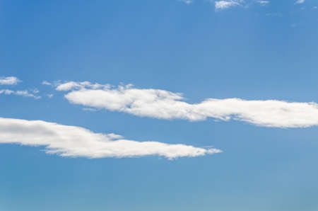 White clouds in a bright blue sky. The beauty of the nature