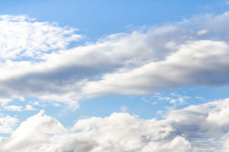 White clouds in a bright blue sky. The beauty of the nature