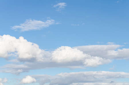 White clouds in a bright blue sky. The beauty of the natureの写真素材
