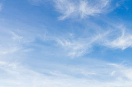 White clouds in a bright blue sky. The beauty of the natureの写真素材
