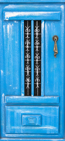 Typical blue wooden door of Santorini island, Greeceの写真素材