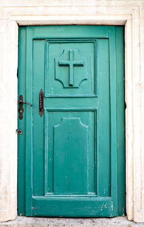 Typical green old wooden door of the old town of Kotor, Montenegroの写真素材