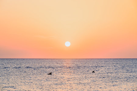 Beautiful sunset with orange sky on the beach of Menorca, Balearic Islands. Sunset, natureの写真素材