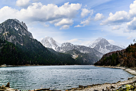 Image of Sant Maurici Lake with snow-capped mountains, in the Aigües Tortes National Park, in the Lleida Pyrenees, Catalonia, Spainの写真素材