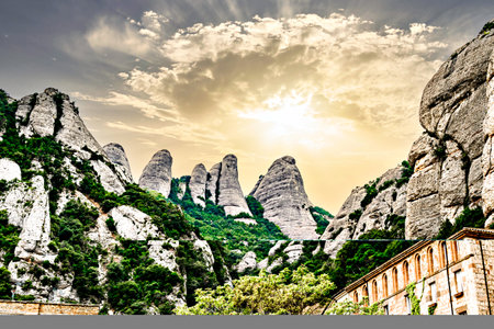 Views of the Montserrat massif, mountain in the province of Barcelona, ââCatalonia on a day with blue sky and white cloudsの写真素材