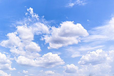 White clouds in a bright blue sky. The beauty of natureの写真素材