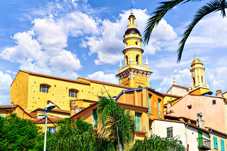 Bell tower of the Basilica of Saint Michael the Archangel in the historic center of the city of Menton on the French Riviera, Cote d'Azur, Franceの写真素材