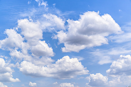 White clouds in a bright blue sky. The beauty of natureの写真素材