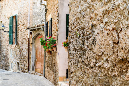 Beautiful views of a street in the picturesque and famous town of Valldemosa, Mallorca, Balearic Islands, Spainの写真素材