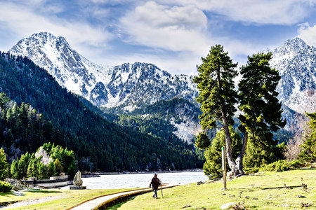 Image of Sant Maurici Lake with snow-capped mountains, in the Aigües Tortes National Park, in the Lleida Pyrenees, Catalonia, Spainの写真素材