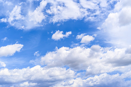 White clouds in a bright blue sky. The beauty of natureの写真素材