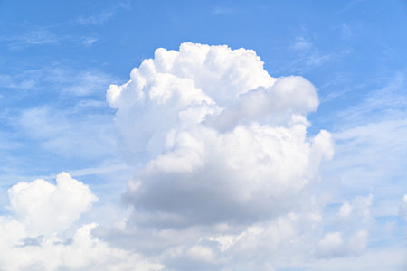 White clouds in a bright blue sky. The beauty of natureの写真素材