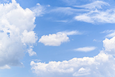 White clouds in a bright blue sky. The beauty of natureの写真素材