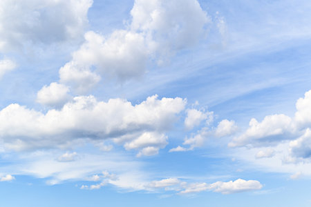 White clouds in a bright blue sky. The beauty of natureの写真素材