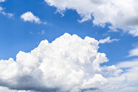 White clouds in a bright blue sky. The beauty of natureの写真素材