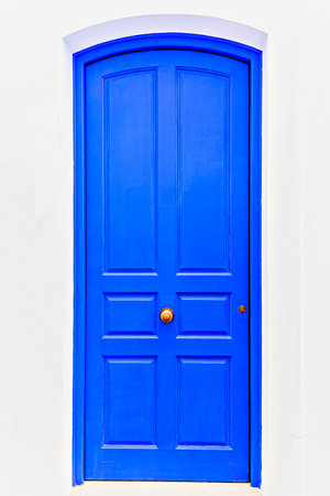 Picturesque blue wooden door of a house in the village of Cadaques, Girona, Spainの写真素材