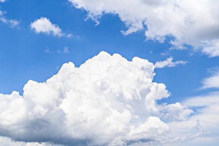 White clouds in a bright blue sky. The beauty of natureの写真素材